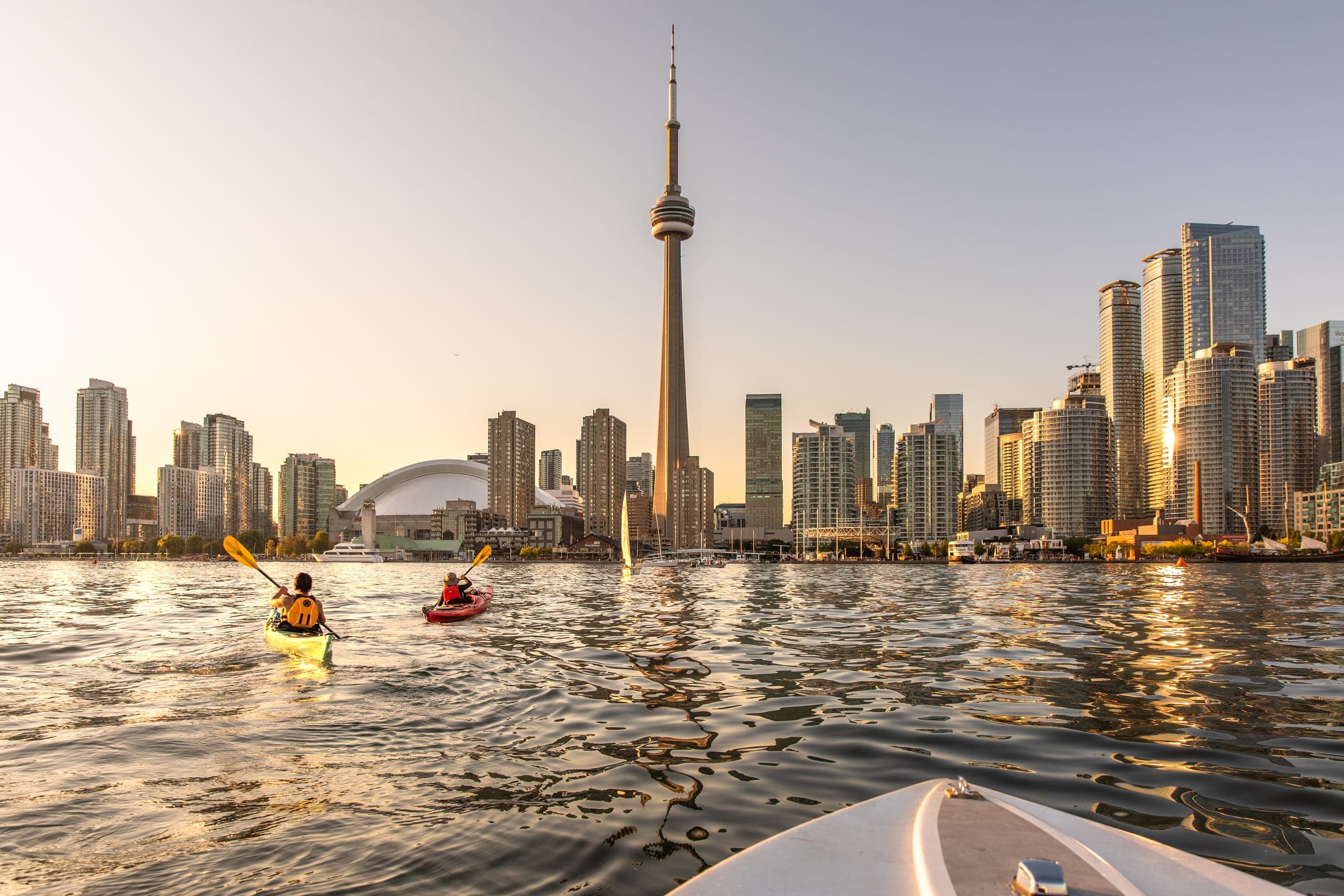 Kayaks and the skyline at sunrise